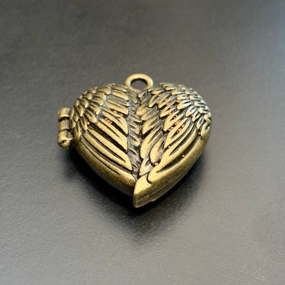 Antique Gold Heart Wings Locket with Metal Micro Dice Set